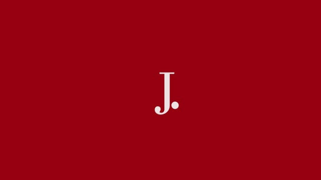 J.